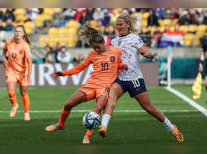 Netherlands' midfielder #10 Danielle van de Donk (L) and USA's midfielder #10 Lindsey Horan (R) fight for the ball during the Australia and New Zealand 2023 Women's World Cup Group E football match between the United States and the Netherlands at Wellington Stadium, also known as Sky Stadium, in Wellington on July 27, 2023.  (Photo by Marty MELVILLE / AFP)