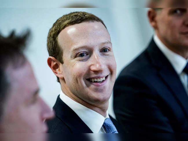 (FILES) Founder and CEO of US online social media and social networking service Facebook Mark Zuckerberg reacts upon his arrival for a meeting with European Commission vice-president in charge for Values and Transparency, in Brussels, on February 17, 2020.  After years of bad press and scandal, Mark Zuckerberg is seeing his reputation spruced up in the fickle world of tech, largely thanks to the increasingly unpredictable behavior of Elon Musk. (Photo by Kenzo TRIBOUILLARD / AFP)