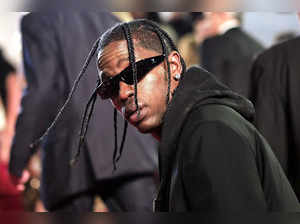 (FILES) US rapper Travis Scott arrives for the screening of the film "The Idol" during the 76th edition of the Cannes Film Festival in Cannes, southern France, on May 22, 2023. US rapper Travis Scott will not face criminal charges for the crowd movement that left ten people dead at the Astroworld festival he co-organized in Texas in November 2021, judicial authorities announced on June 29."No criminal charges will be filed," Harris County District Attorney Kim Ogg's office said in a statement. (Photo by Valery HACHE / AFP)