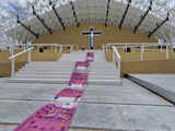 The art of protest: Portuguese street artist makes a statement against Pope's visit costs with massive banknote carpet