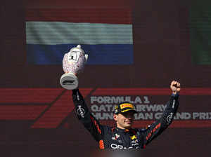 Dutch Formula One driver Max Verstappen of Red Bull Racing celebrates on the pod...