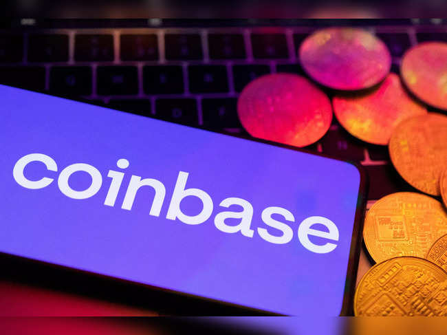 Illustration shows smartphone with displayed Coinbase logo