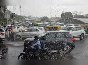 Gurugram: Vehicles move amid heavy monsoon rainfall, in Gurugram. (PTI Photo)(...