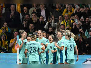 Australia's players celebrate after Australia's forward #16 Hayley Raso scored her team's second goal during the Australia and New Zealand 2023 Women's World Cup Group B football match between Canada and Australia at Melbourne Rectangular Stadium, also known as AAMI Park, in Melbourne on July 31, 2023.  (Photo by WILLIAM WEST / AFP)