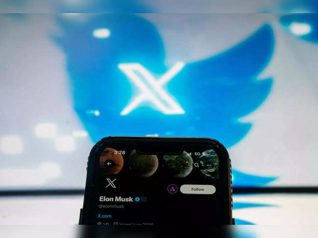 This illustration photo created in Washington, DC, on July 24, 2023, shows the Twitter page of Elon Musk in front of the new X Twitter logo and old bird Twitter logo. Elon Musk killed off the Twitter logo on July 24, 2023, replacing the world-recognized blue bird with a white X as the tycoon accelerates his efforts to transform the floundering social media giant. Musk and the company's new chief executive Linda Yaccarino announced the rebranding on July 23, 2023, scrapping one of technology's most iconic brands in the latest shock move since the tycoon took over Twitter nine months