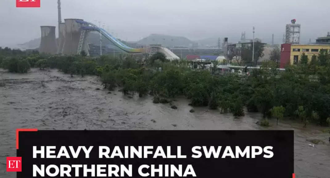 China rains: Heavy rainfall swamps northern China; streets flooded ...