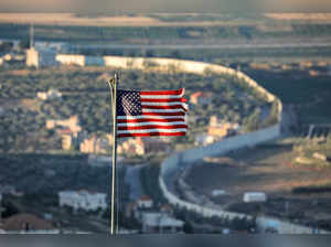 A fraying US flag flies near the northern Israeli kibbutz of Misgav Am close to the border wall with Lebanon on July 19, 2023.  (Photo by JALAA MAREY / AFP)