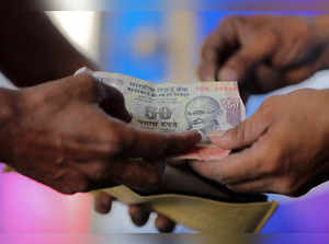 Indian rupee range bound in near term, to rise a bit in a year