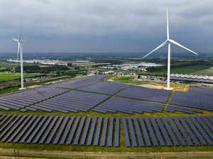 FILE PHOTO: A solar panel park and wind turbines are seen in Geldermalsen