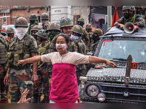 A demonstrator blocks an army vehicle as she protests against mass burial of Kuki-Zomi people killed in Manipur's ethnic violence, in Imphal on August 3, 2023. (Photo by AFP)