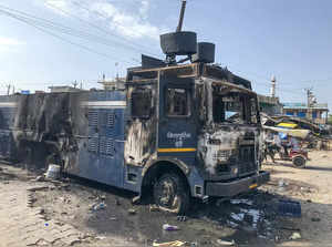 Nuh: Wreckage of a Police vehicle that was set on fire during communal clashes, ...