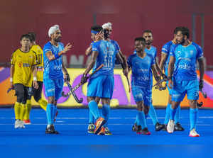 Chennai: India's Karthi Selvam with teammates celebrates after scoring a goal ag...