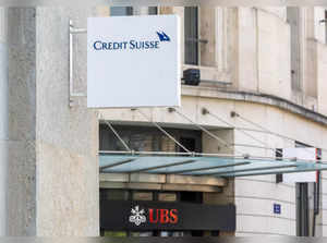 FILE PHOTO: The logos of Swiss bank Credit Suisse and UBS are seen in Geneva