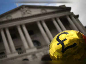 A balloon representing the billions of pounds of profit earned by British banks is seen during a protest outside the Bank Of England in the City of London on August 3, 2023, ahead of another expected rise in the base rate. The Bank of England is set to raise its key interest rate for a 14th time in a row Thursday as UK inflation stays high, adding to a cost-of-living crisis. (Photo by Daniel LEAL / AFP)