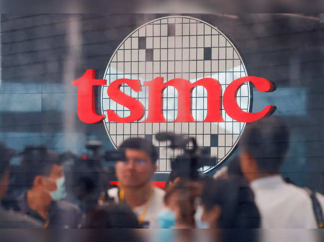 Taiwan Semiconductor Manufacturing Company's (TSMC) logo is seen while people attend the opening of the TSMC global R&D center in Hsinchu
