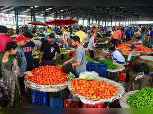 Jalandhar: Vendors sell tomatoes at a vegetable market, in Jalandhar. Tomato pri...