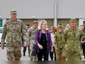 This undated handout photo received from the US Army on August 9, 2023 shows US Secretary of the Army Christine Wormuth (C) walking with senior US and Australian military officials in an unknown location.  Australia could be a testing ground for US hypersonic and other long-range precision weapons under the AUKUS pact, top Pentagon official Wormuth told AFP on August 9. - ----EDITORS NOTE ----RESTRICTED TO EDITORIAL USE MANDATORY CREDIT " AFP PHOTO / US ARMY" NO MARKETING NO ADVERTISING CAMPAIGNS - DISTRIBUTED AS A SERVICE TO CLIENTS (Photo by Handout / US ARMY / AFP) / ----EDITORS NOTE