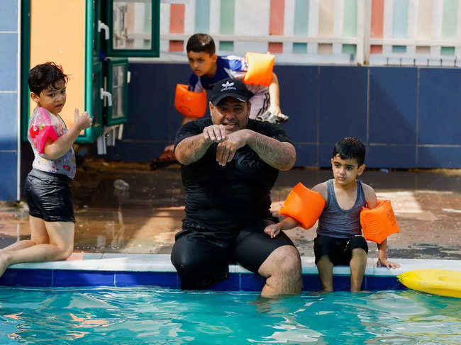 Gaza's amputee coach is an inspiration to young swimmers