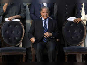 Pakistan's Prime Minister Shehbaz Sharif waits for a group photo with lawmakers ...