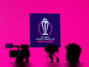 FILE PHOTO: Cameras are seen in front of the logo of the upcoming ICC Men's Cricket World Cup before a press conference in Mumbai