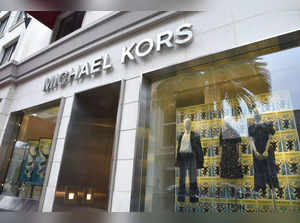 (FILES) The Michael Kors store in Beverly Hills, California, on September 25, 2018.   Tapestry, the US parent company of lifestyle brands including Coach and Kate Spade, said on August 10, 2023, it will acquire Michael Kors' parent Capri for $8.5 billion, creating a global fashion giant. The all-cash takeover aims to boost sales across an upscale portfolio by combining customer data streams from Tapestry and Capri Holdings, broadening geographic reach and achieving some $200 million in annual cost savings within three years of the deal closing, a joint press release said. (Photo by Robyn Beck / AFP)