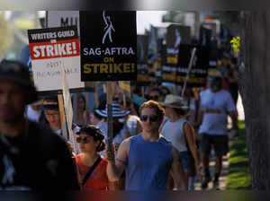 FILE PHOTO: Hollywood actors and writers on strike outside Disney studios in California