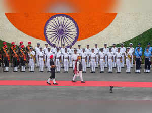 New Delhi:Prime Minister Narendra Modi inspects the guard of honour during the 7...