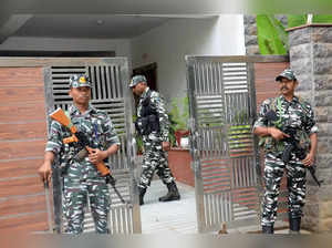 Ranchi: Security personnel stand guard during an Enforcement Directorate (ED) ra...