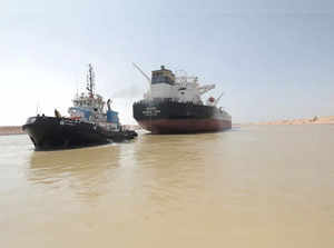 A tugboat works to refloat the Oil Products Tanker BURRI after it collided with LNG Tanker BW Lesmes in Suez Canal
