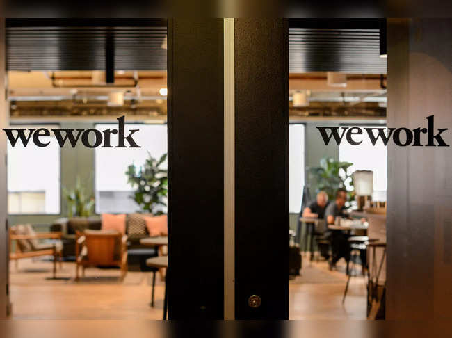 WeWork shares sink after warning of bankruptcy risk