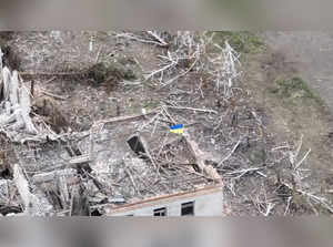 Ukrainian forces raise the national flag in the settlement of Robotyne