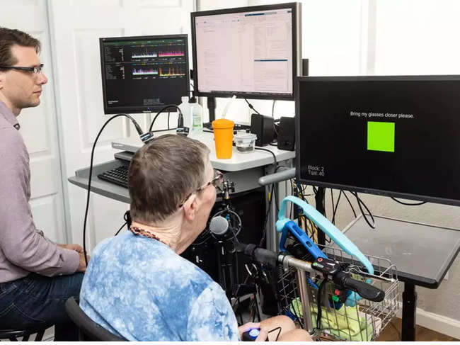 ​Combining sensors with AI, brain-computer interfaces such as the one being used here, have given two women the ability to speak again. Image: Steve Fisch
