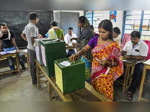 Nadia: Women cast their votes for Panchayat elections at a polling station, in N...