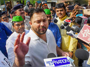 Patna: Bihar Deputy Chief Minister Tejashwi Yadav speaks with the media as he ar...