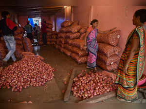 Navi Mumbai: Workers sort onions at the APMC Onion-Potato Market, in Navi Mumbai...