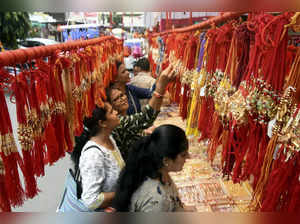 Nagpur: Young women select 'Rakhis' to buy at a market ahead of the 'Raksha Band...