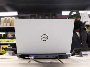 A person looks at a Dell laptop for sale in a store in Manhattan, New York City