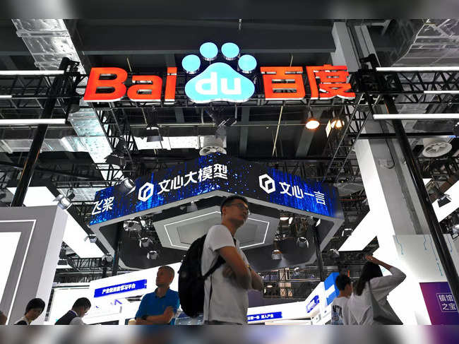 Visitors walk past the booth of Baidu during the World Artificial Intelligence Conference (WAIC) in Shanghai on July 6, 2023.