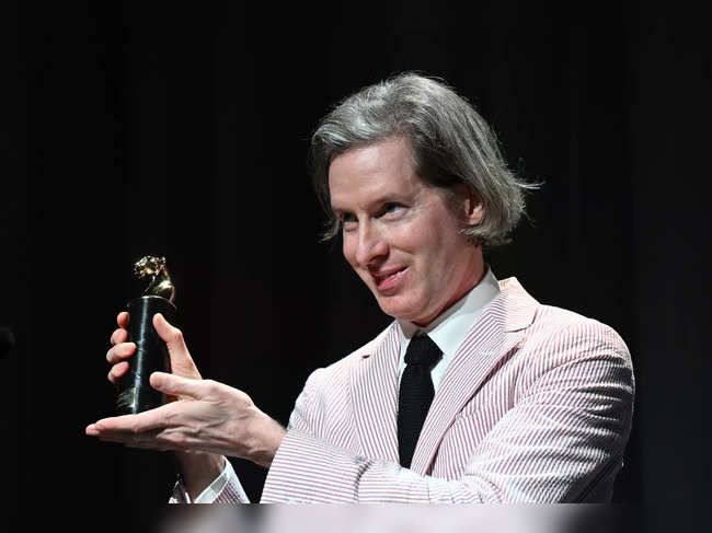 Director Wes Anderson poses with the Cartier Glory To The Filmmaker award at the 80th Venice Film Festivalon September 1, 2023 at Venice Lido.