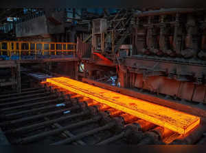 A slab of steel is pictured on the production line at the Tata Steel Port Talbot integrated iron and steel works in south Wales on 15 August, 2023. Port Talbot's integrated steelworks is responsible for producing high quality steel, as well as shaping the town’s iconic skyline. It performs several identifiable processes which occur throughout the site so that raw iron ores and coal can be converted into ‘slab’ and finished steel products.   (Photo by Geoff Caddick / AFP)