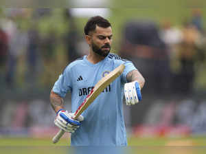 India's Virat Kohli looks at his arm before the start of the one day internation...