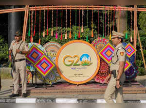 Police personnel outside Rajghat ahead of the G20 Summit, in New Delh...