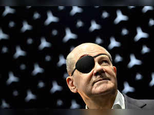 German Chancellor Olaf Scholz wearing an eyepatch after injuring his face while jogging visits the booth of German car maker Mercedes-Benz during his tour to open the International Motor Show (IAA) in Munich, southern Germany, on September 5, 2023.