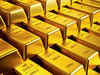 Gold at one-week low as firm dollar, yields dominate mood