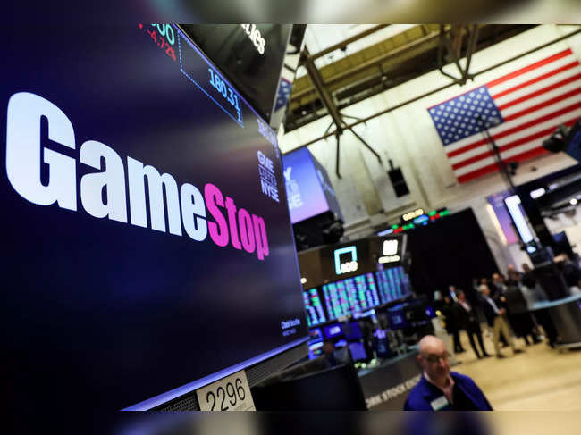 A screen displays the logo and trading information for GameStop at the NYSE  in New York