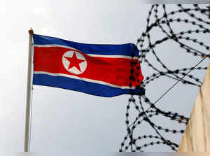 FILE PHOTO: FILE PHOTO: A North Korea flag flutters next to concertina wire at the North Korean embassy in Kuala Lumpur