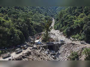 Mandi: Vehicles move on the landslide-hit and rain damaged Chandigarh-Manali Hig...