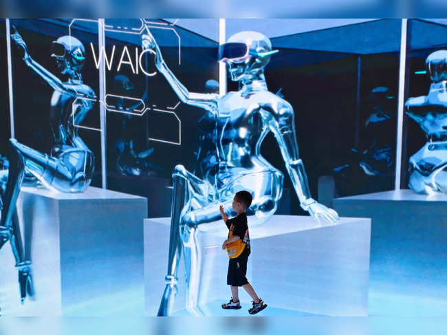 (FILES) A child visits the World Artificial Intelligence Conference (WAIC) in Shanghai on July 6, 2023.  China put into force this week its newest regulations on artificial intelligence-generated content, a watered-downed version of stricter draft rules that seek to keep the country in the AI race while maintaining firm censorship on online content.  -  (Photo by WANG ZHAO / AFP)