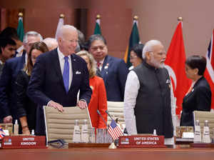 US President Joe Biden and India's Prime Minister Narendra Modi arrive to attend the opening session of the G20 Leaders' Summit in New Delhi on September 9, 2023.