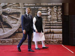 France's President Emmanuel Macron (L) and India's Prime Minister Narendra Modi arrive for a luncheon on the sidelines of the G20 summit in New Delhi on September 10, 2023.